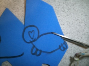 1. first draw the outline of a walrus on a piece of foam and cut it out and then trace that so you have two