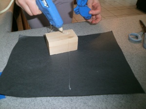 3. then put glue on the piece of wood
